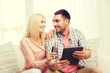 Image showing happy couple with tablet pc and credit card