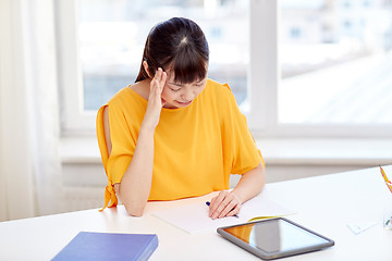 Image showing tired asian woman student with tablet pc at home