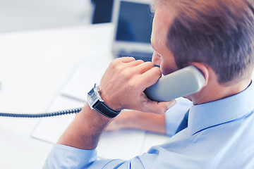 Image showing handsome businessman talking on the phone