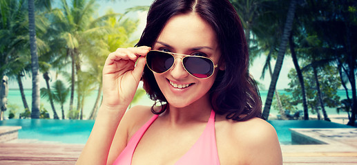 Image showing happy woman in sunglasses and swimsuit