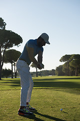 Image showing golf player hitting shot