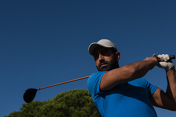 Image showing golf player hitting shot