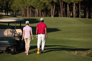 Image showing couple walking on golf course