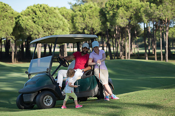 Image showing couple in buggy on golf course