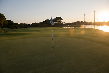 Image showing golf ball on edge of  the hole