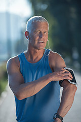 Image showing portrait of handsome senior jogging man