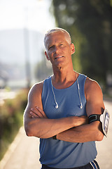 Image showing portrait of handsome senior jogging man