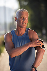 Image showing portrait of handsome senior jogging man