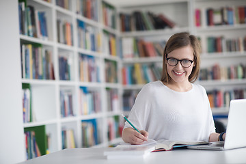 Image showing female student study in school library