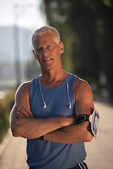 Image showing portrait of handsome senior jogging man