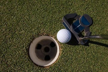 Image showing hitting golf ball to hole