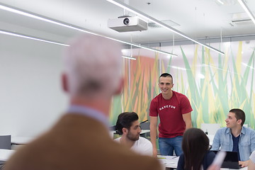 Image showing teacher with a group of students in classroom