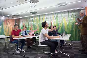 Image showing teacher with a group of students in classroom