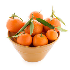Image showing Tangerines on ceramic yellow bowl 