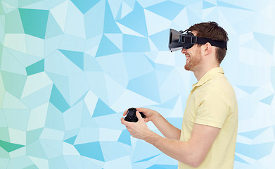 Image showing happy man in virtual reality headset with gamepad