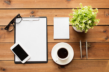 Image showing close up of coffee, clipboard and notepad