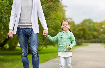 Image showing close up of father and little girl walking in park