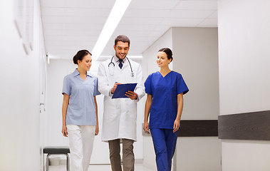 Image showing group of medics at hospital with clipboard