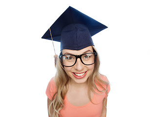 Image showing smiling young student woman in mortarboard