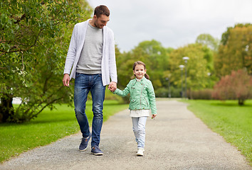 Image showing happy family walking in summer park