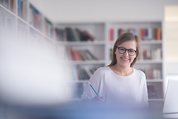 Image showing female student study in school library