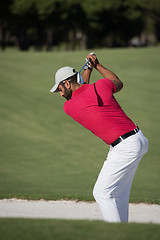 Image showing golfer hitting a sand bunker shot