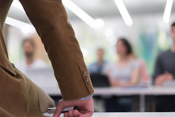 Image showing close up of teacher hand while teaching in classroom