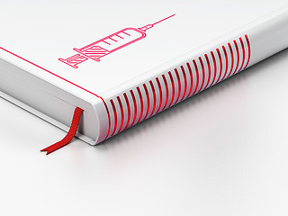 Image showing Health concept: closed book, Syringe on white background