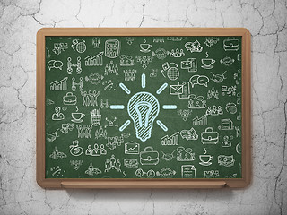 Image showing Business concept: Light Bulb on School board background