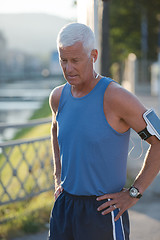 Image showing portrait of handsome senior jogging man