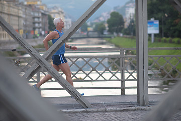 Image showing handsome senior man  jogging