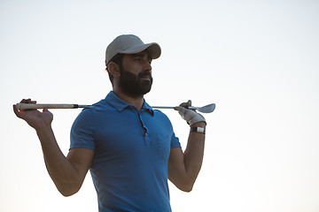 Image showing golfer  portrait at golf course on sunset