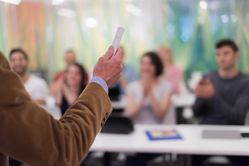 Image showing close up of teacher hand while teaching in classroom