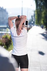 Image showing blonde woman  stretching before morning jogging