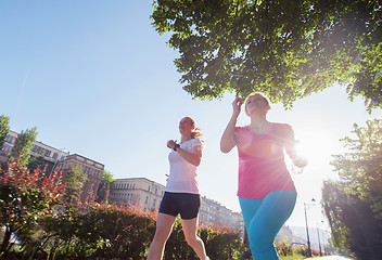 Image showing female friends jogging