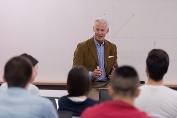 Image showing teacher with a group of students in classroom