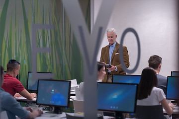 Image showing teacher and students in computer lab classroom