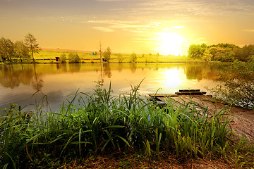 Image showing Yellow sunset on pond