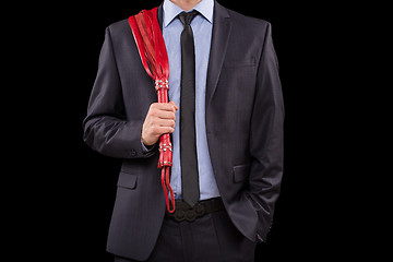 Image showing man in business suit with chained hands. handcuffs for sex games