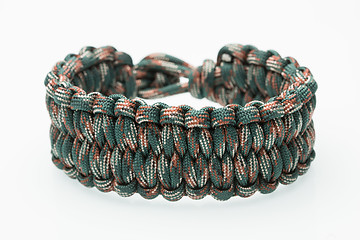 Image showing green braided bracelet on white background