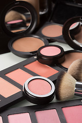 Image showing make-up cosmetics. compact powder, mineral foundation and makeup brushes