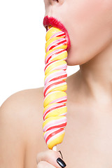 Image showing Close-up shot of woman\'s mouth bright red lips with lollipop. blowjob simulation