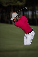 Image showing golfer hitting a sand bunker shot