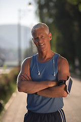 Image showing portrait of handsome senior jogging man