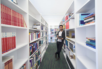 Image showing student with tablet in library