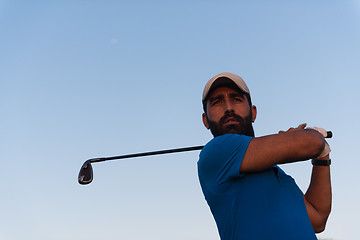 Image showing golfer  portrait at golf course on sunset