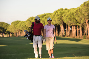 Image showing couple walking on golf course