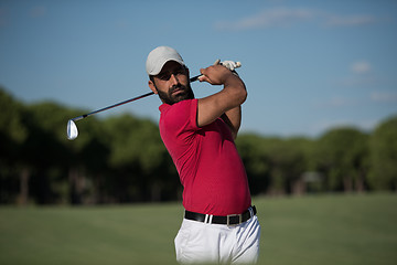 Image showing golfer hitting a sand bunker shot