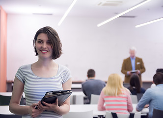 Image showing portrait of happy female student in classroom