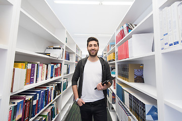 Image showing student with tablet in library
